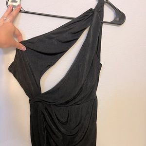 Black, on shoulder mini dress. Cinched at waist